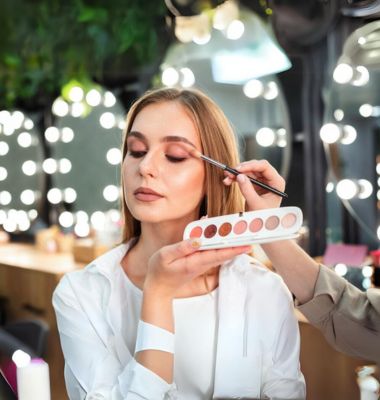 a girl sitting in lucknow makeup academy